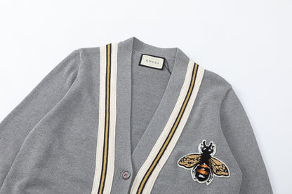 Wool cardigan with bee on chest