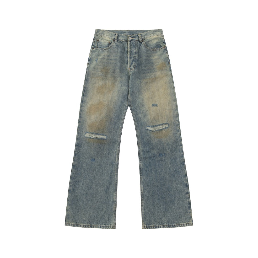 Mud-dyed distressed jeans