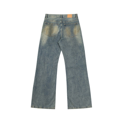 Mud-dyed distressed jeans