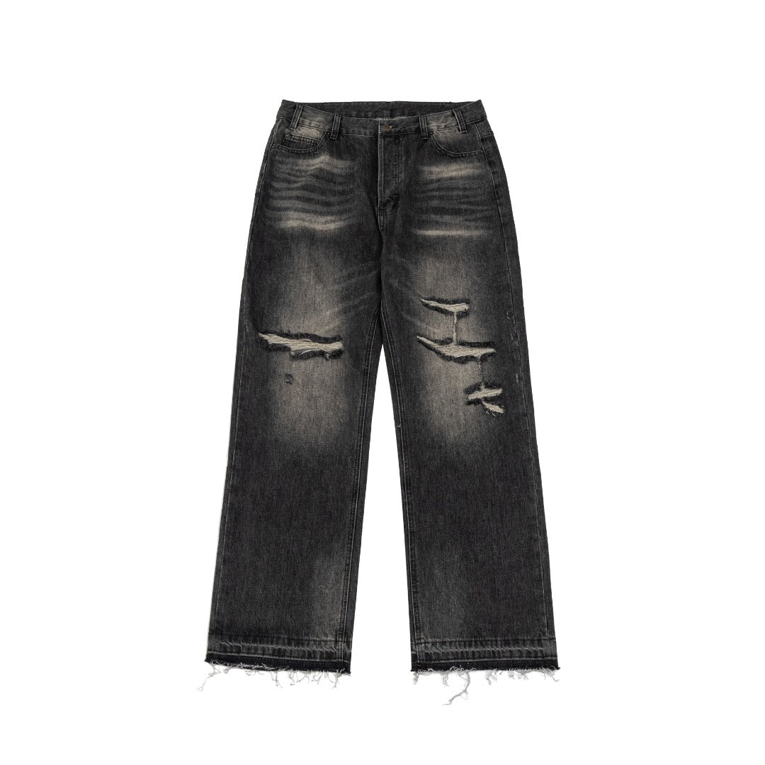 Washed ripped denim trousers