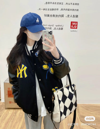 Two-color baseball jacket with small flower and letter embroidery