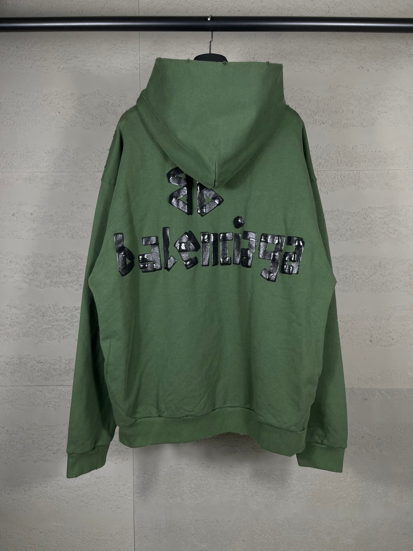 Washed and distressed hooded sweatshirt